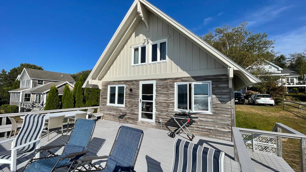 Shore Leave cottage exterior with deck and seating